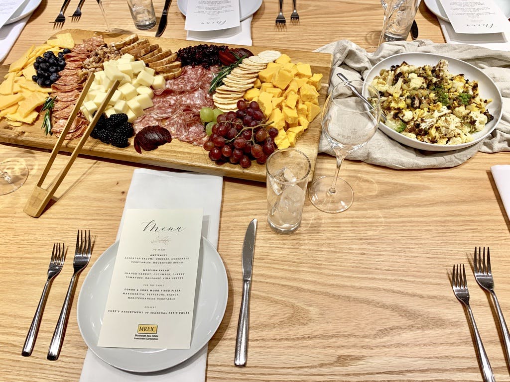 a bunch of food sitting on top of a wooden table
