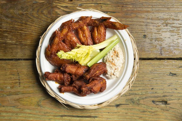 achiote hot wings with Edam cheese dip