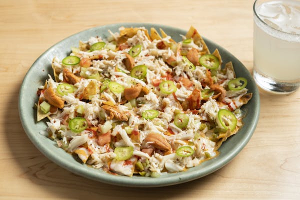 crab nachos with sea urchin queso