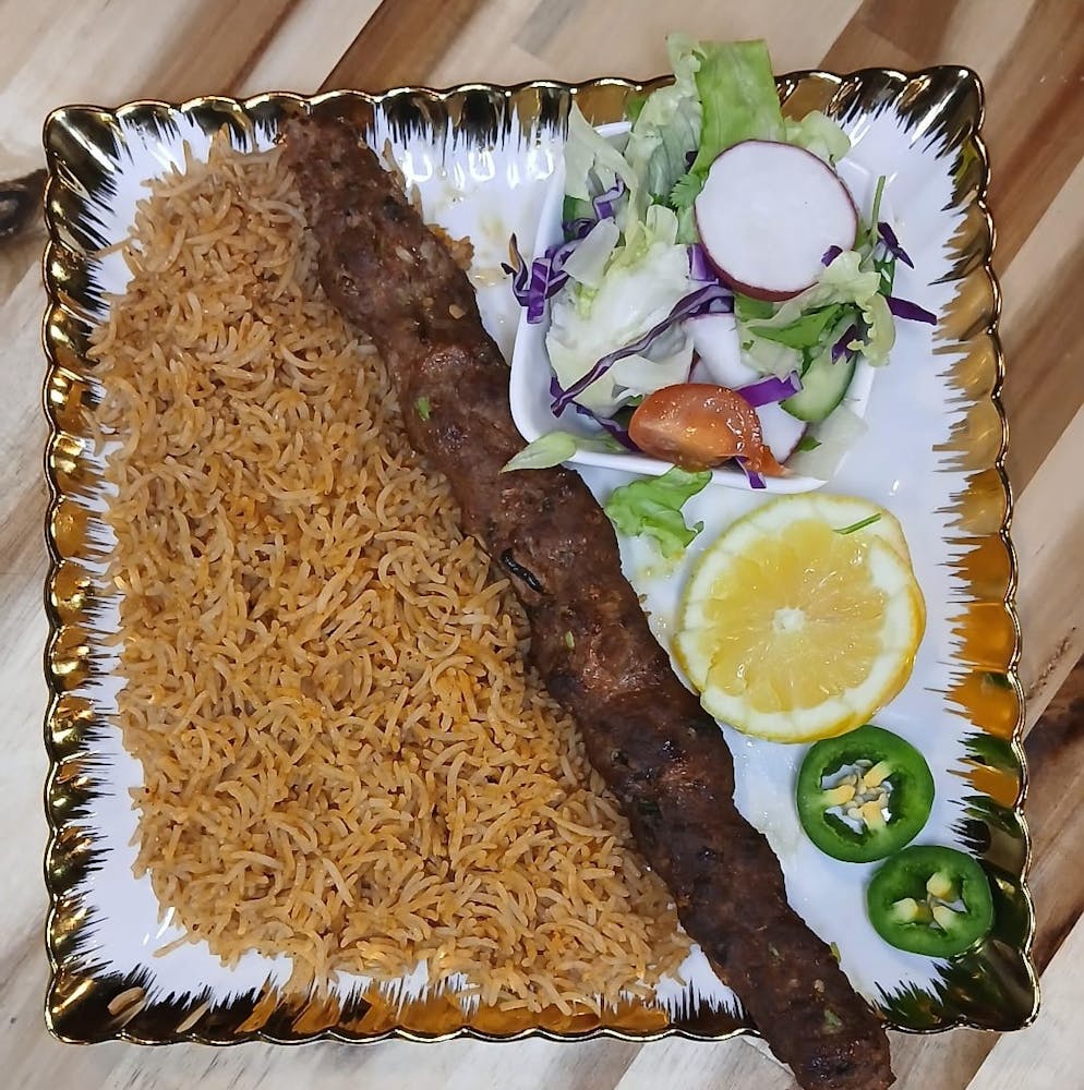 a group of meat on a grill