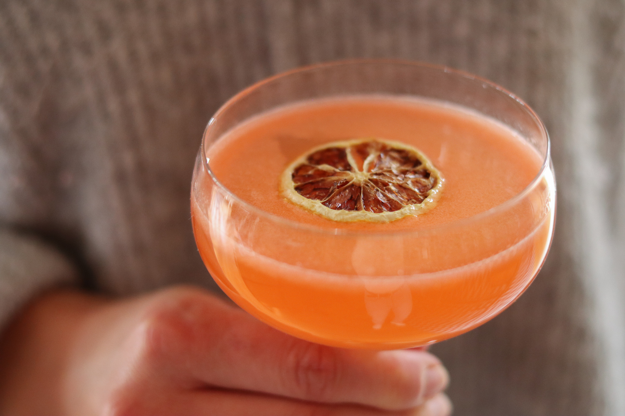 a close up of a glass of orange juice