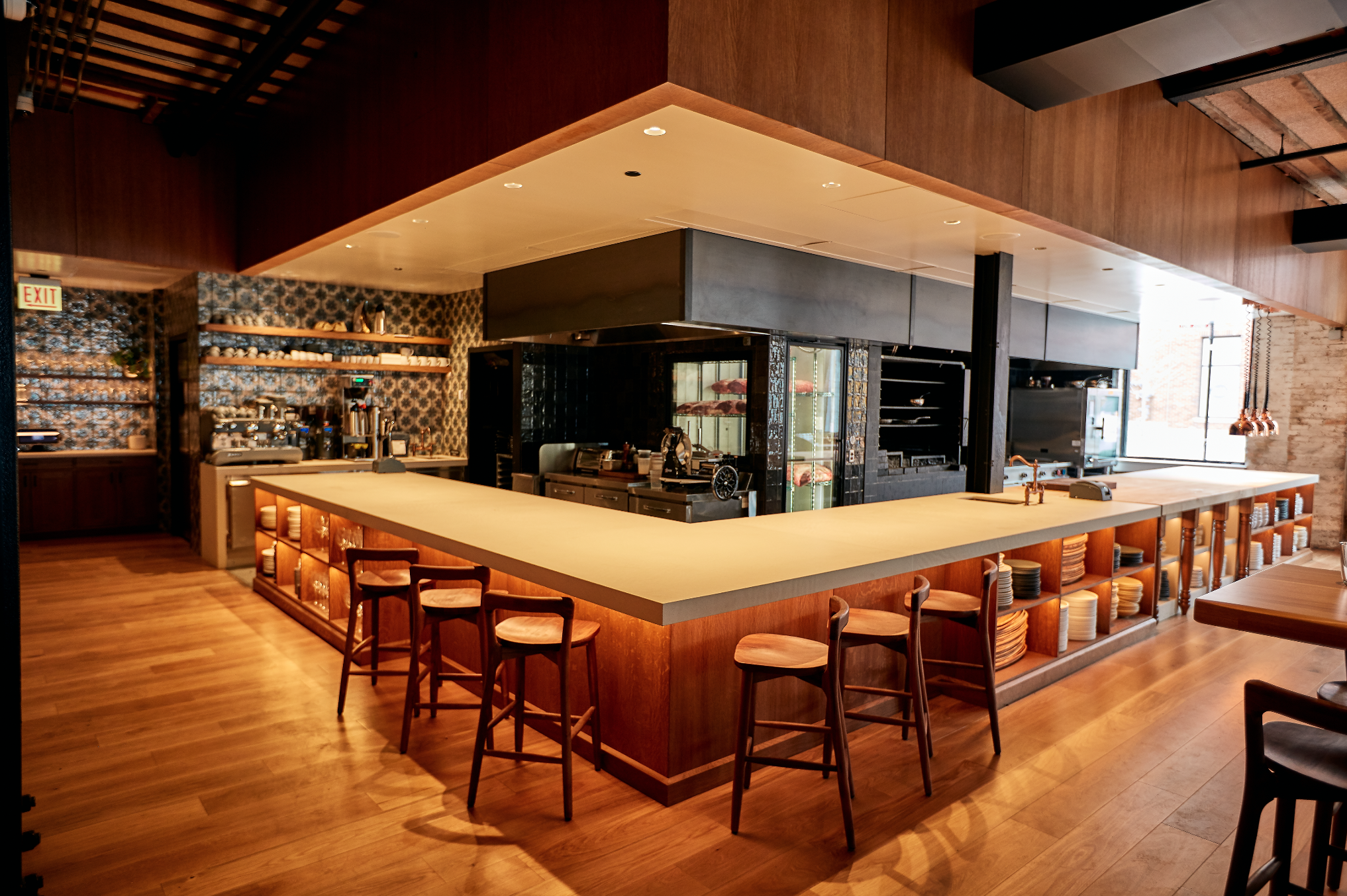 a kitchen with wooden cabinets and a dining room table