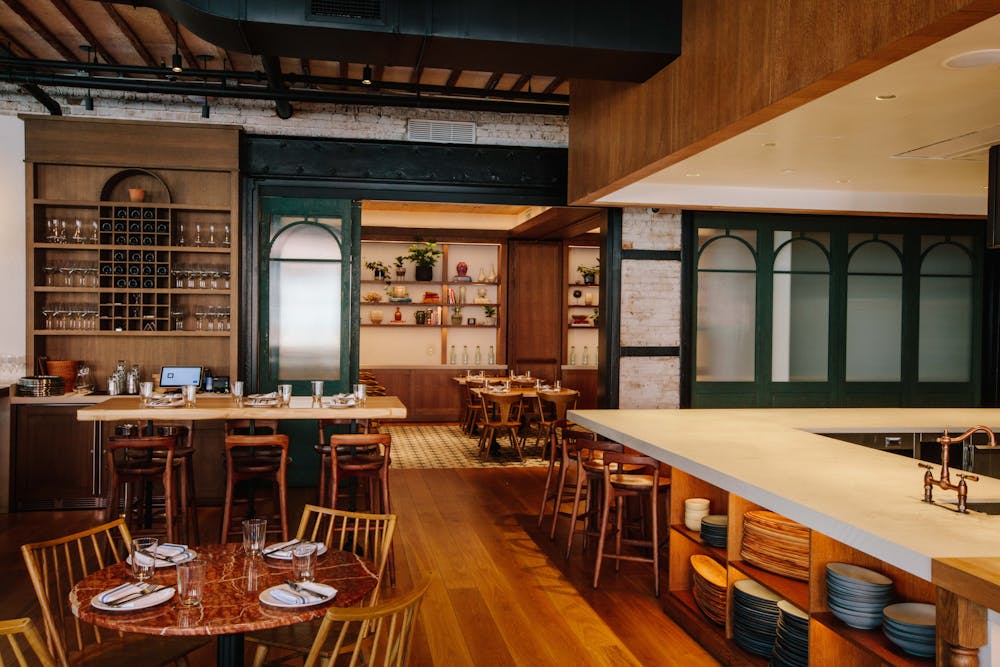 a row of wooden benches sitting on top of a table