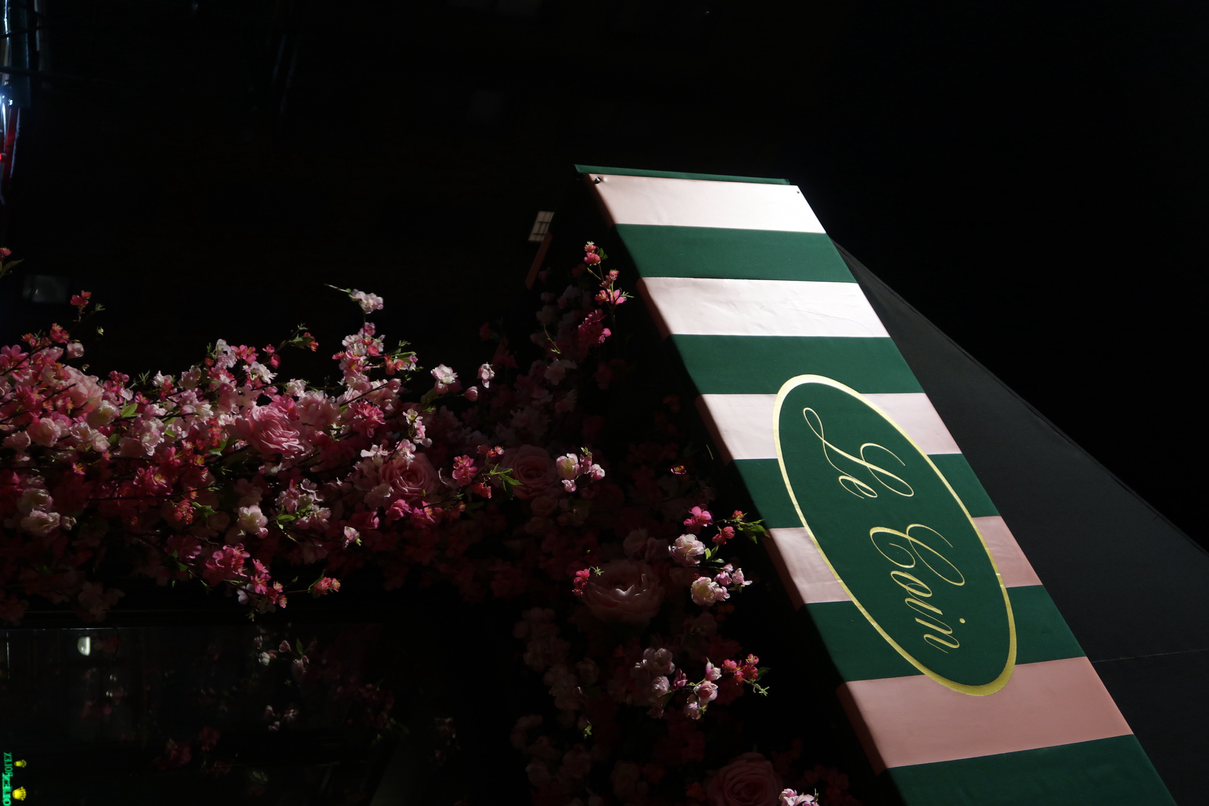 a street sign at night