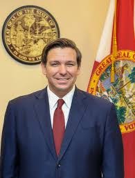 Ron DeSantis wearing a suit and tie