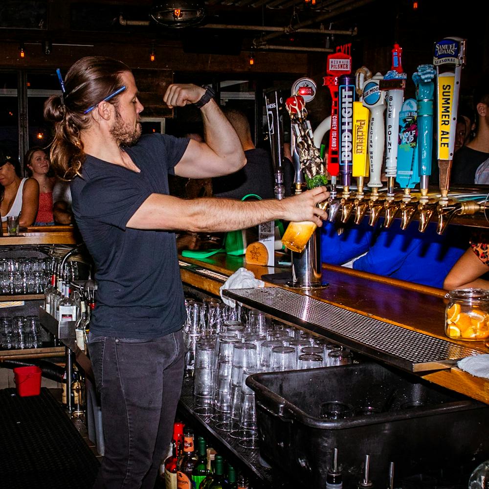 bartender pouring a beer
