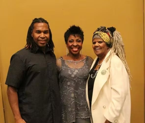 Gladys Knight and woman posing for a photo