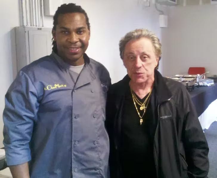 Frankie Valli standing posing for the camera