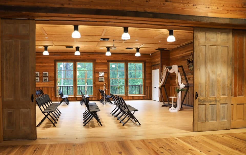 a living room filled with furniture on top of a hard wood floor