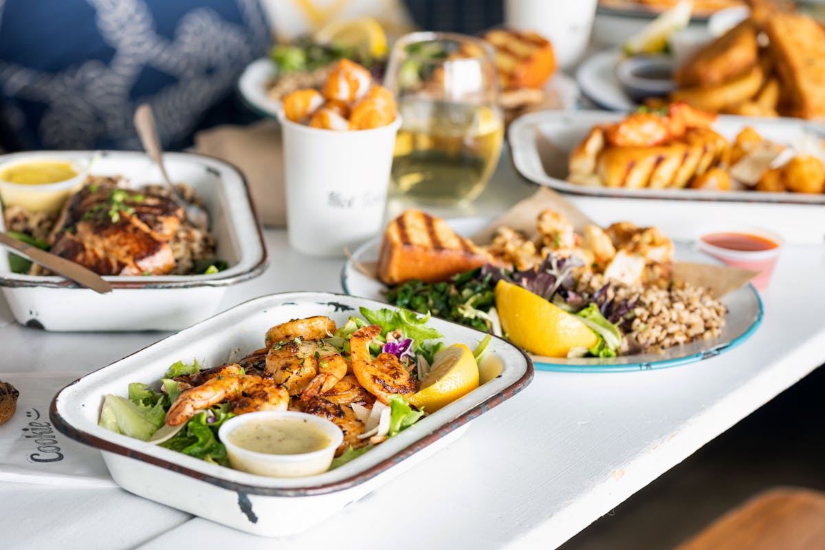 plates of food with shrimp and salad
