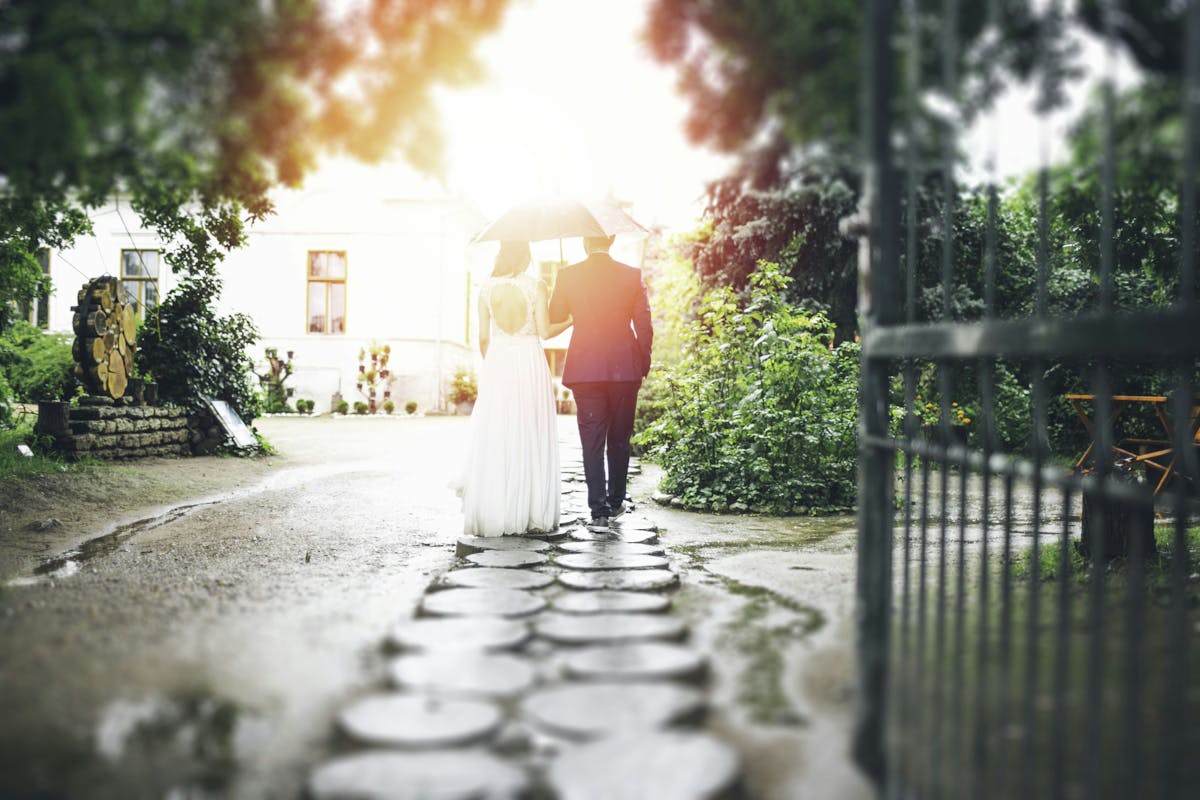 a close up of a couple walking in a street