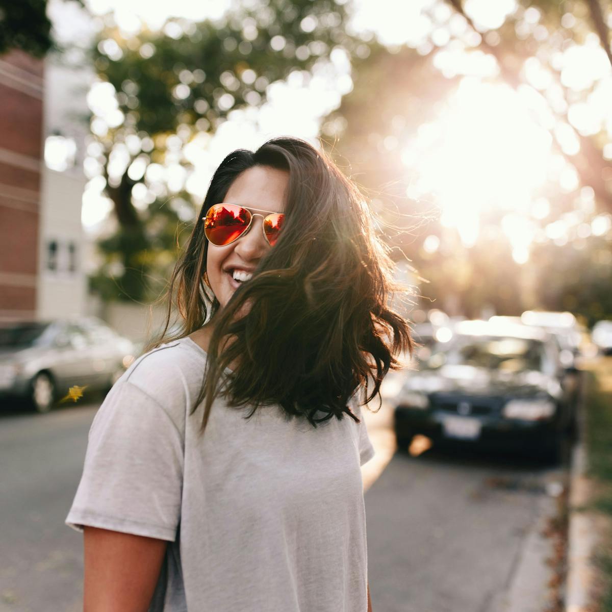 a woman standing on a sidewalk