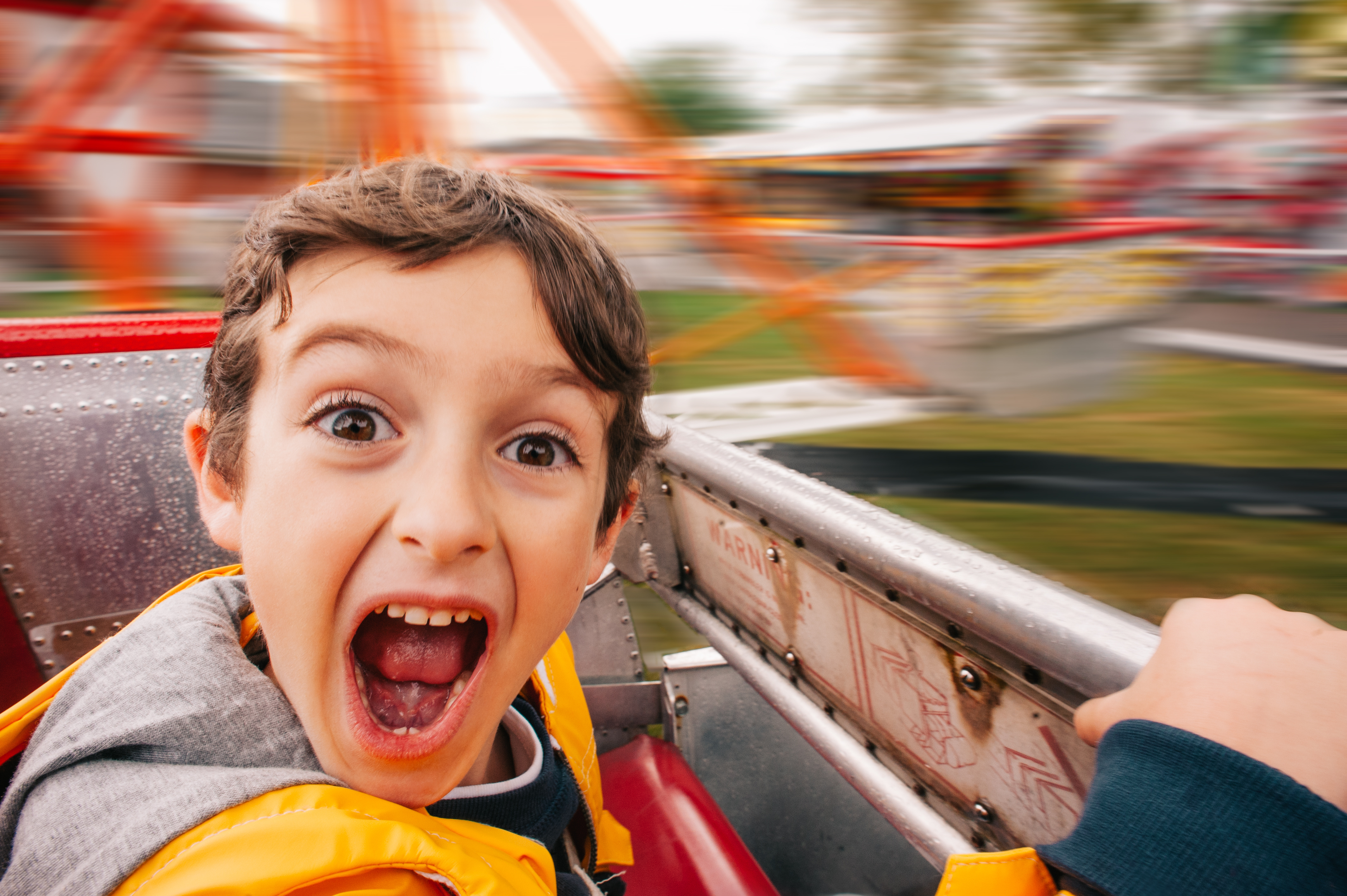 a young boy who is smiling at the camera