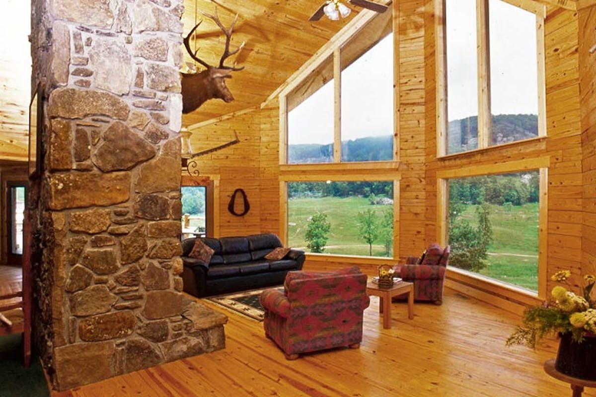 a fire place sitting in a living room with a stone fireplace