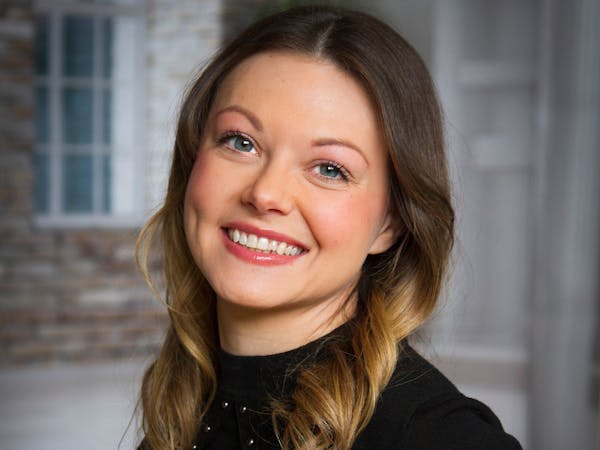 a woman smiling for the camera