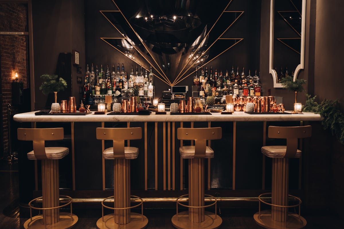 a vase of flowers sits in front of a mirror