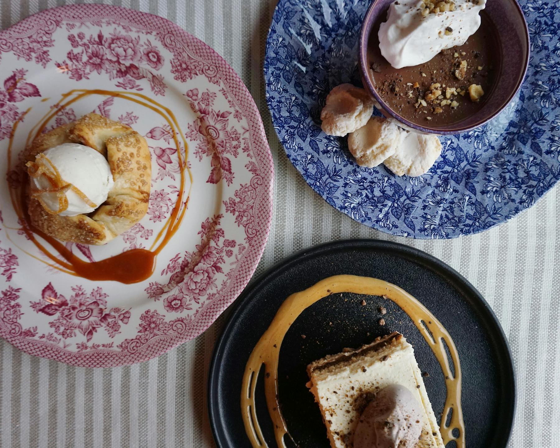 a dessert on a plate next to a cup of coffee