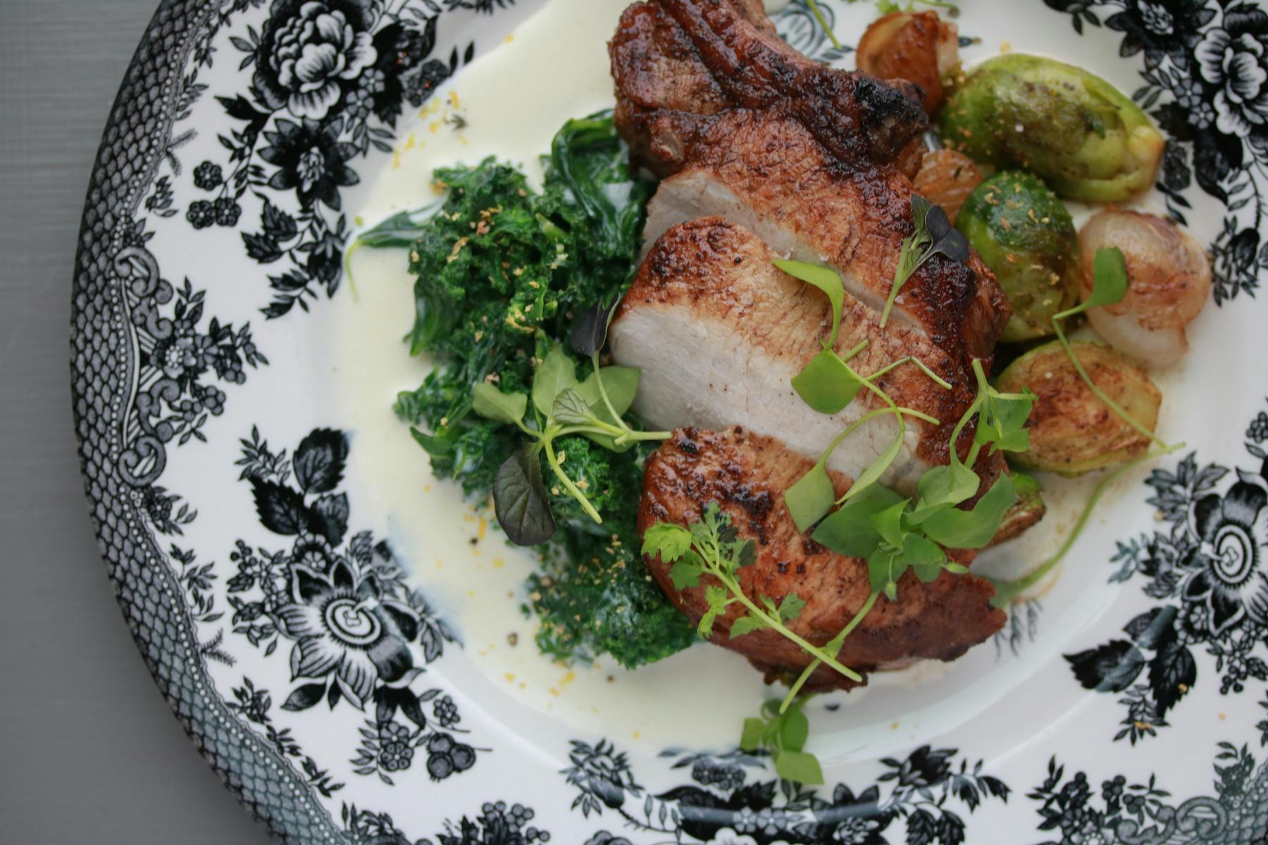 a white plate topped with meat potatoes and broccoli