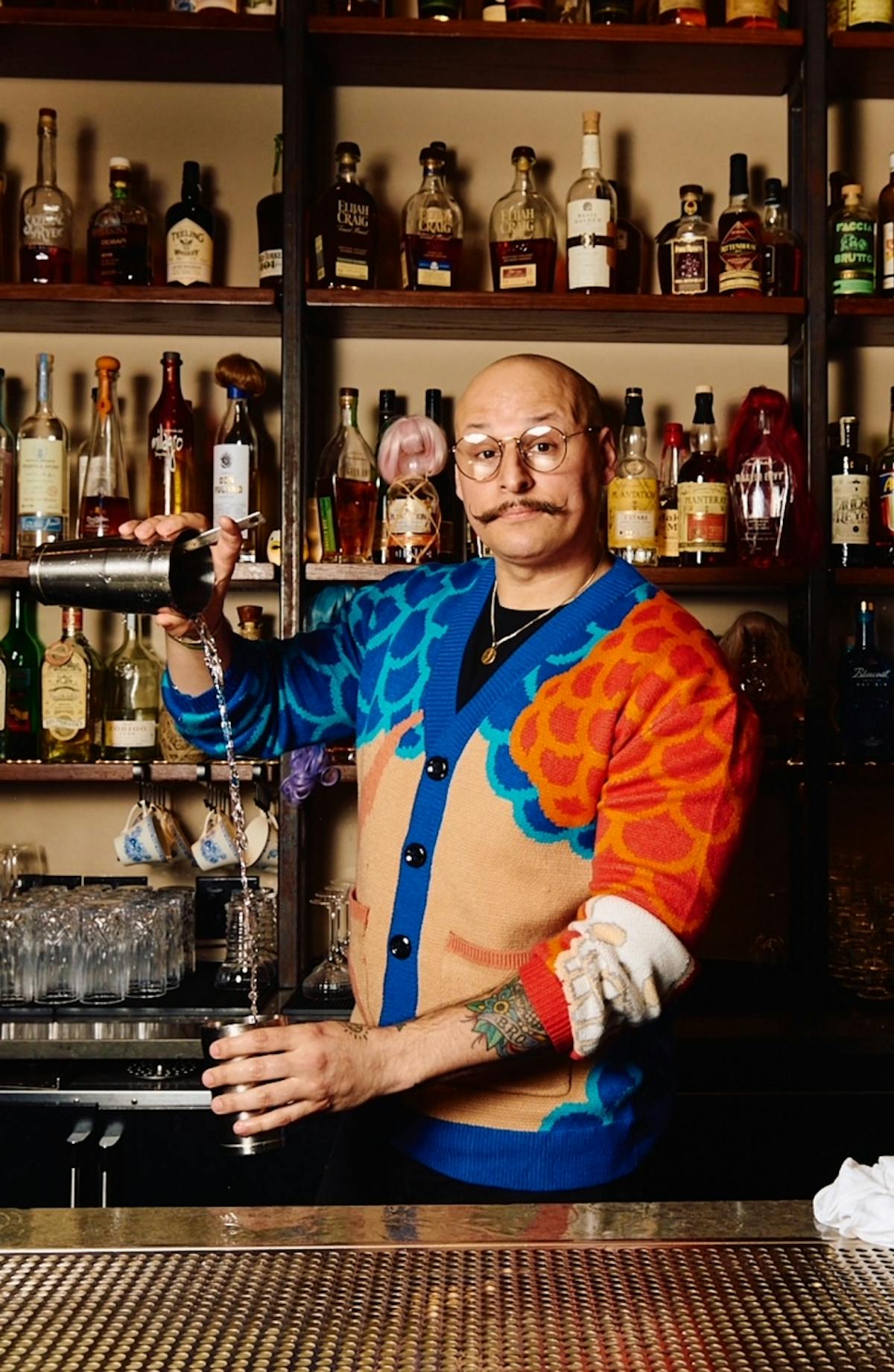 a man holding a bottle of wine