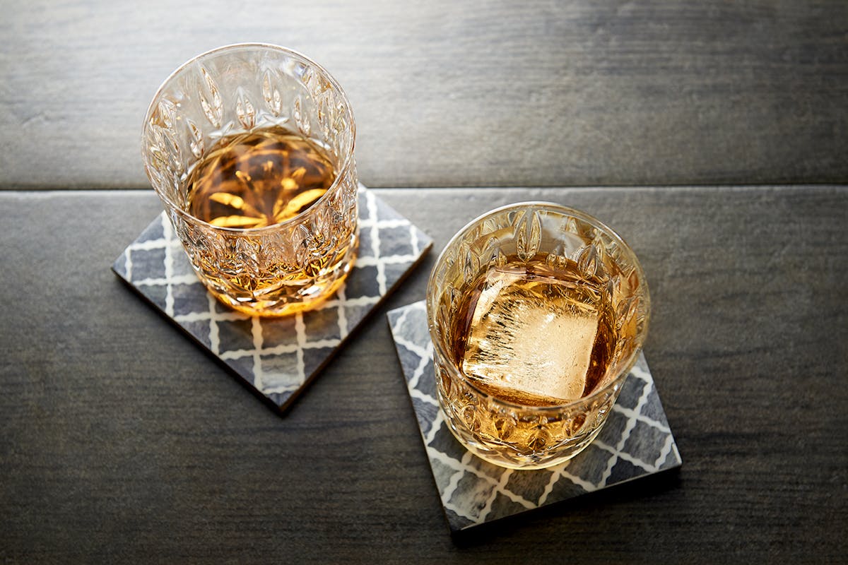 two drinks sitting on coasters