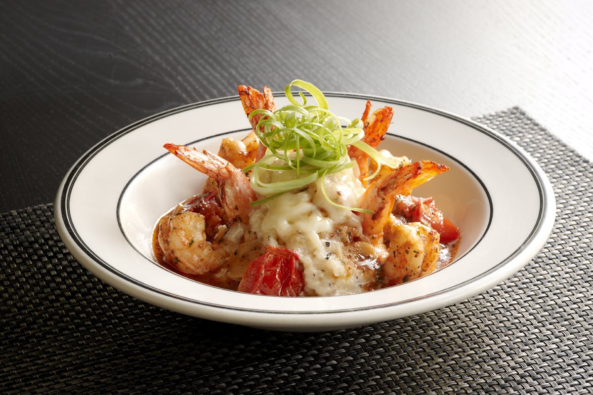 a bowl of shrimp and grits