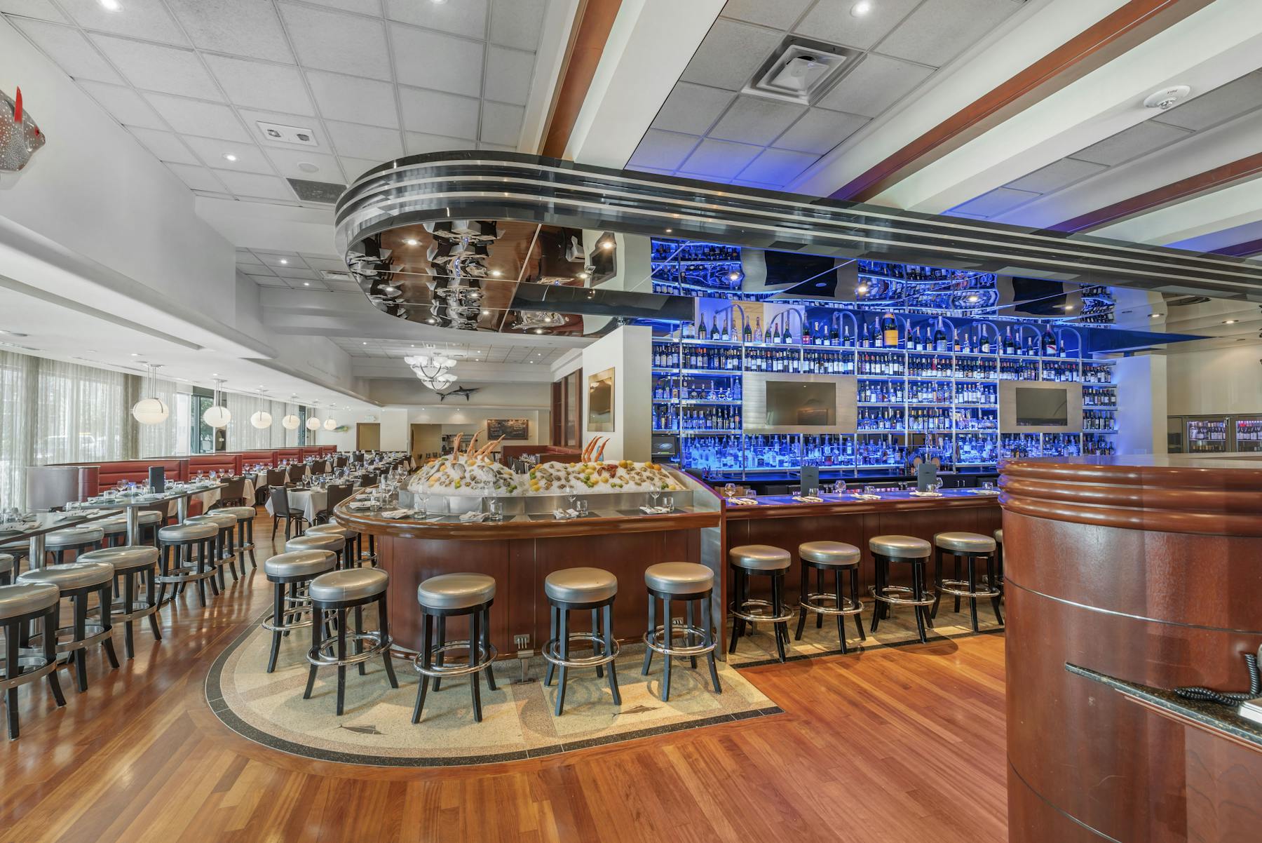a restaurants bar with large tv screens
