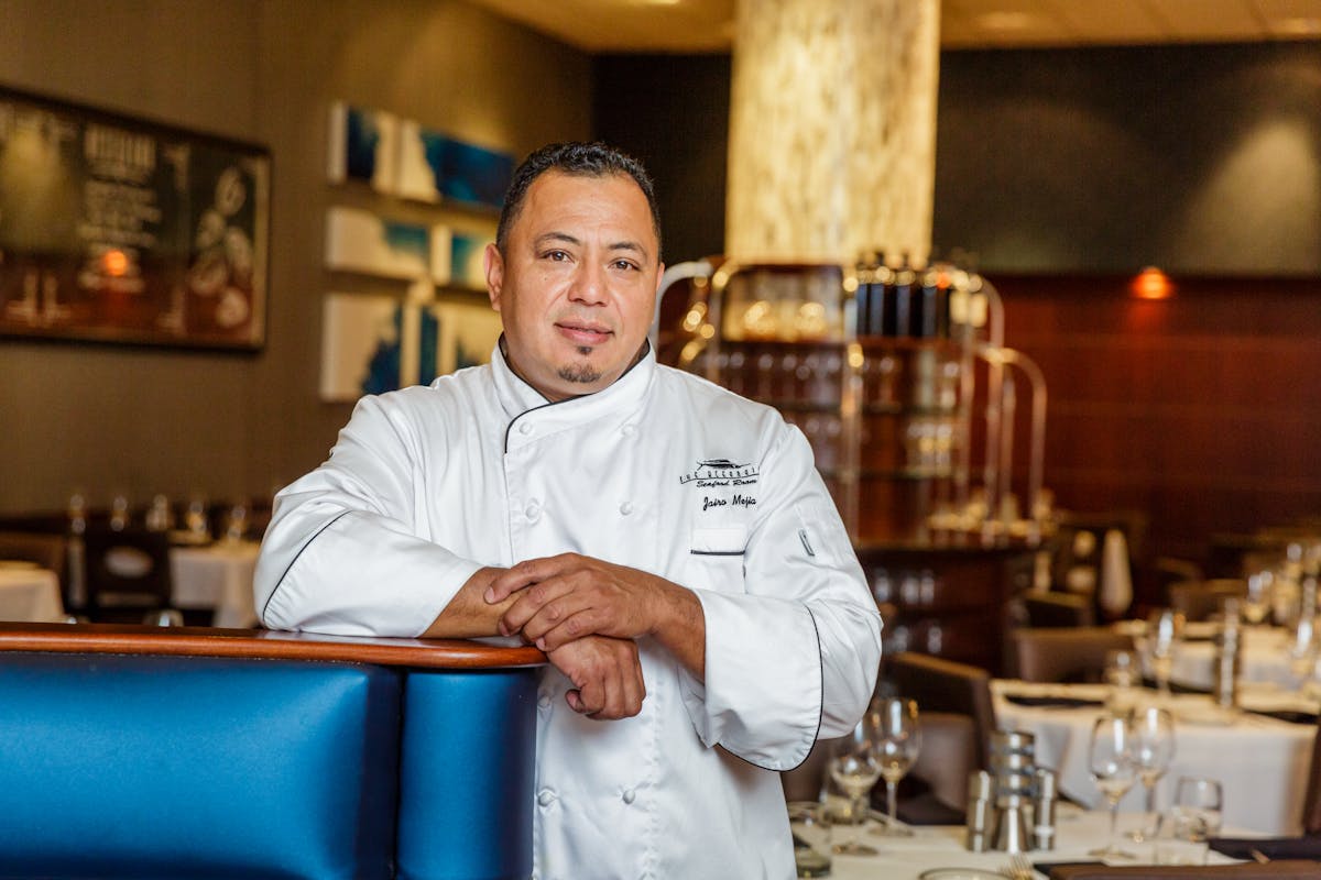a man sitting at a table in a restaurant