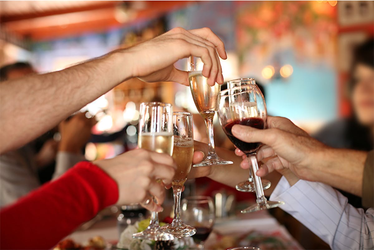 a person holding a wine glass