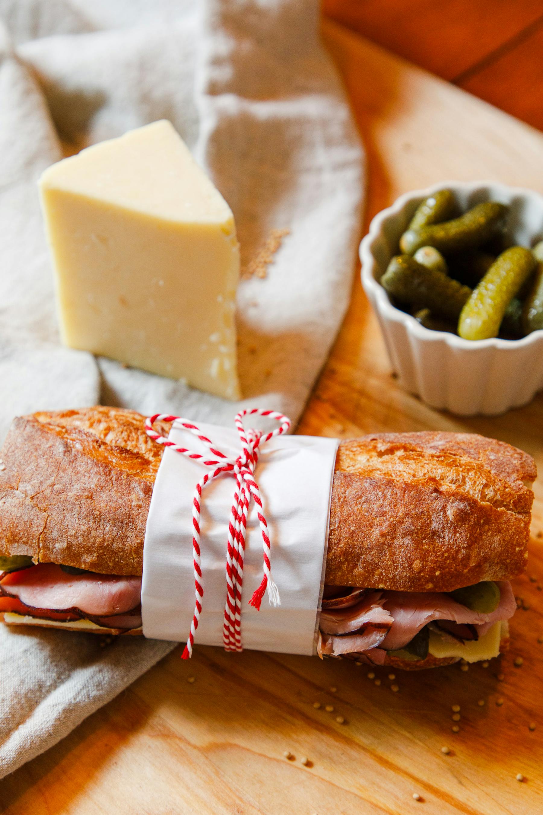 a sandwich sitting on top of a wooden table