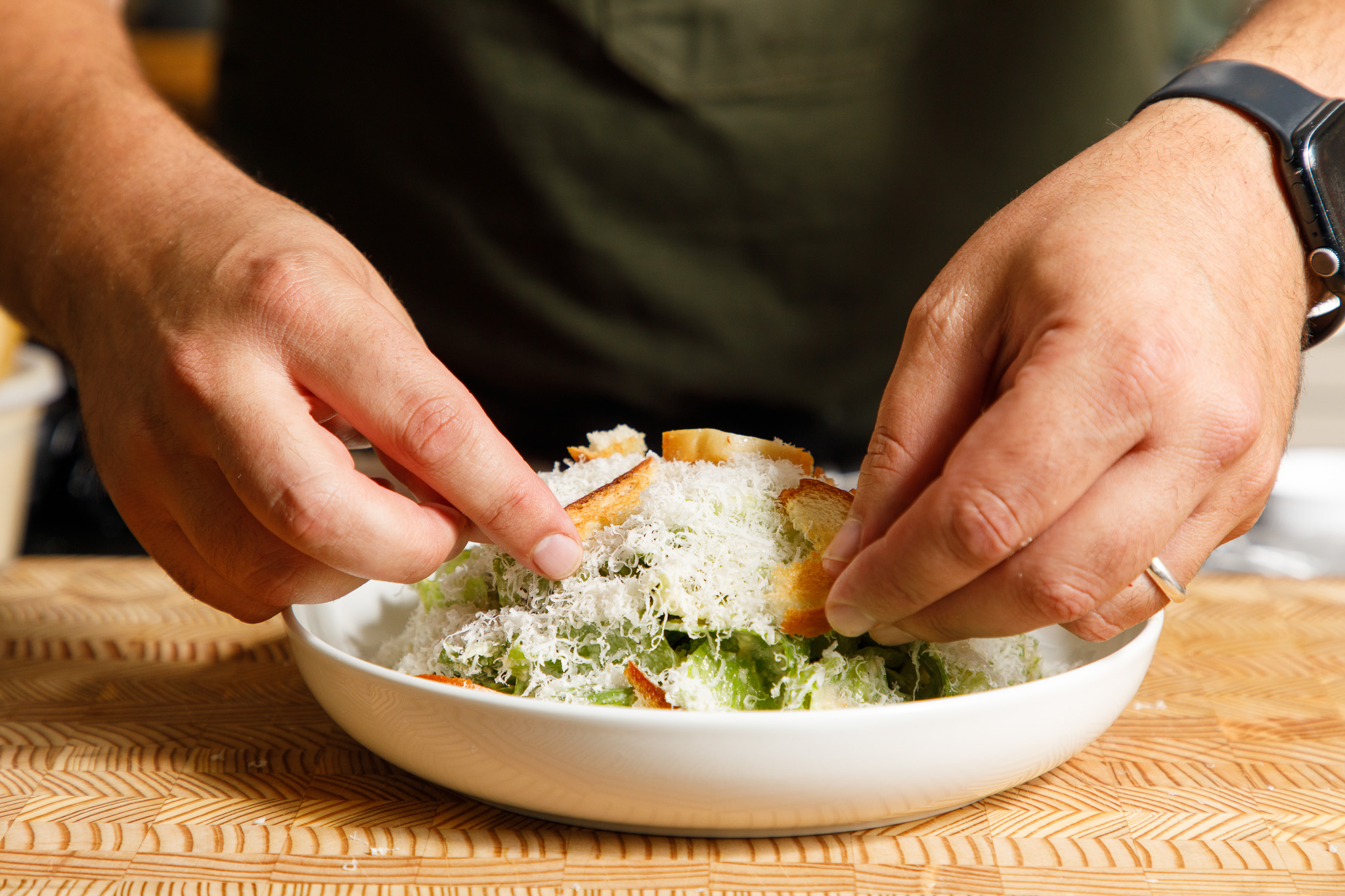 a close up of a person cutting a piece of food