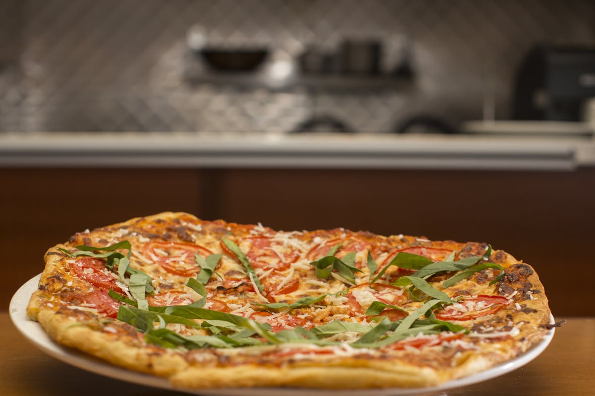 a pizza sitting on top of a table