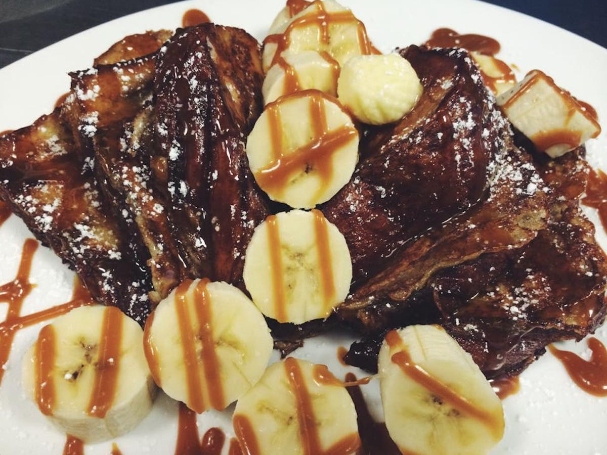 a plate of food with a slice of ice cream