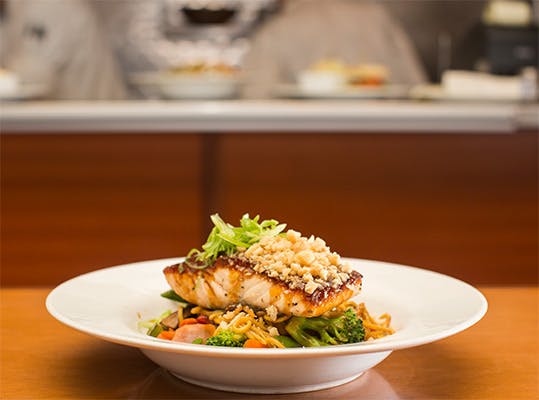 a plate full of food sitting on a table