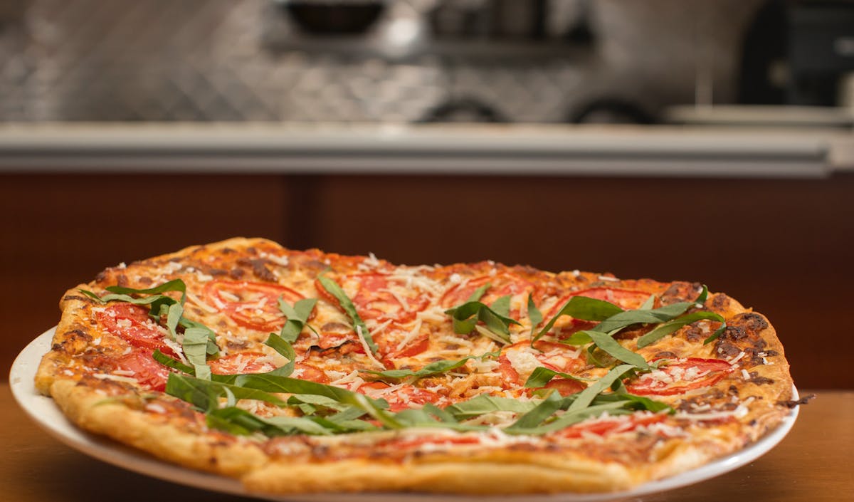 a pizza sitting on top of a table