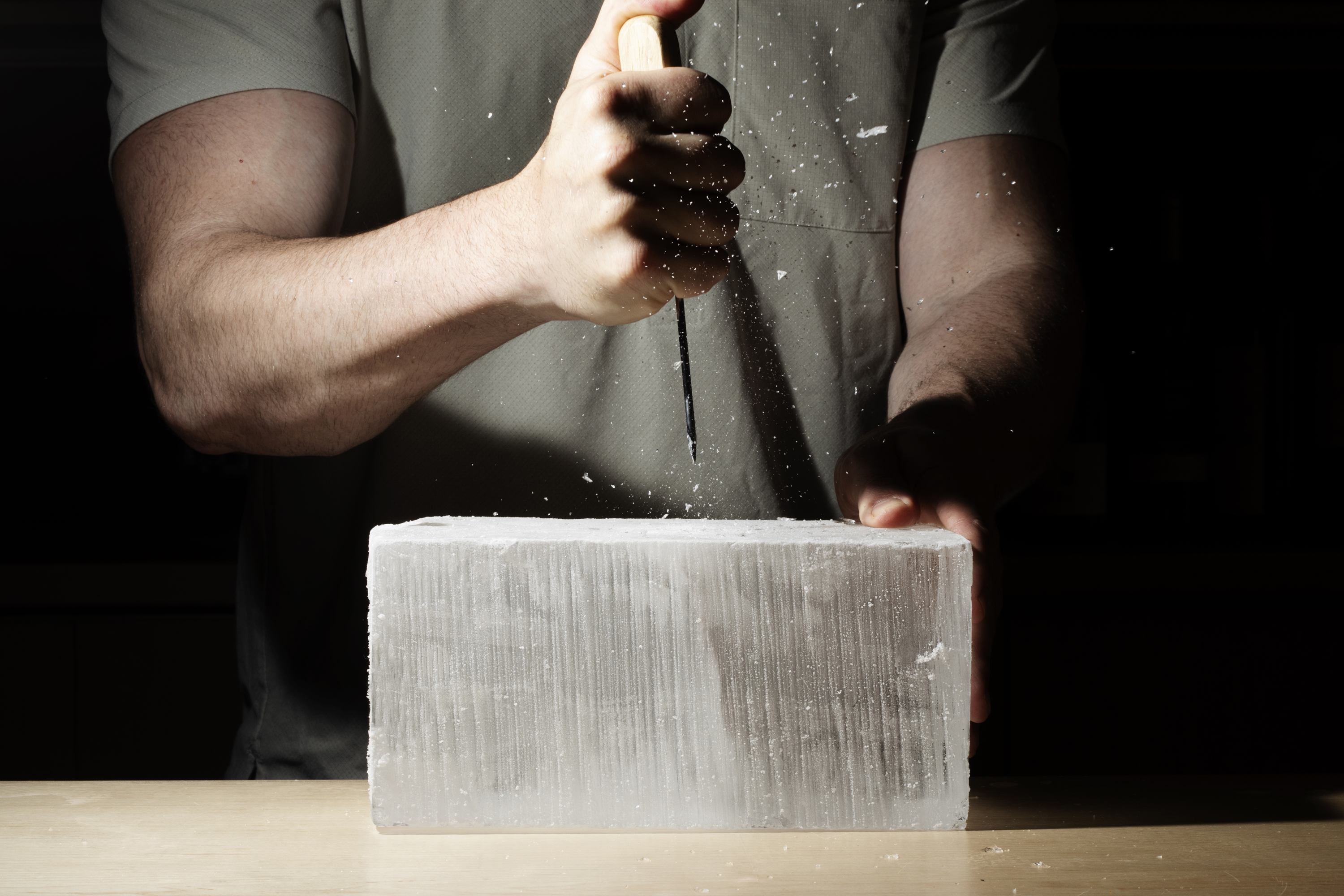 a person chipping ice