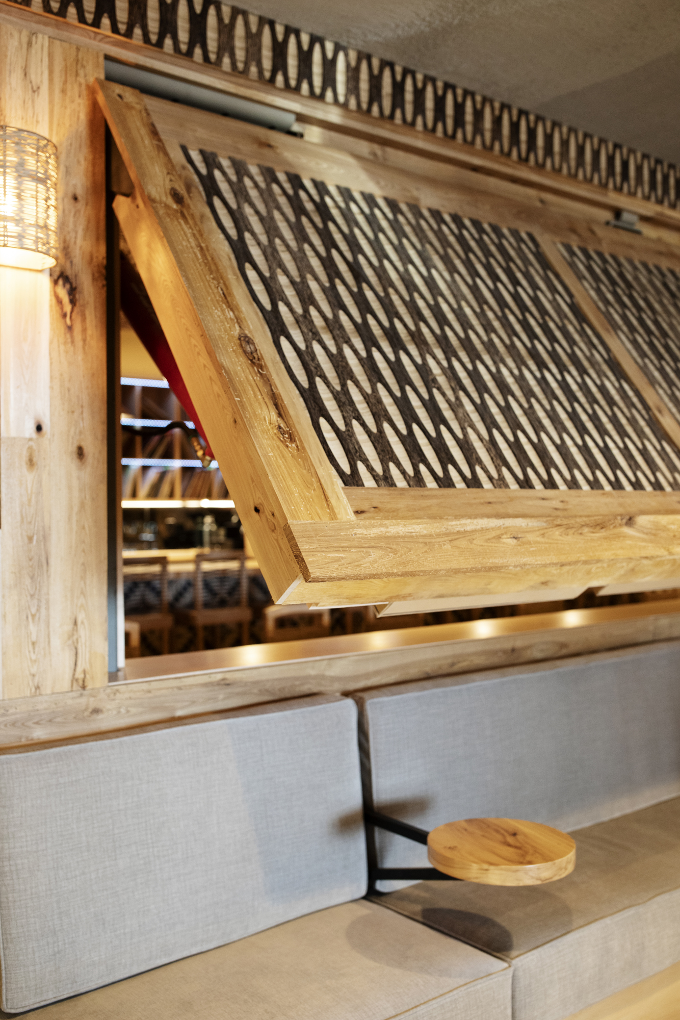 a wooden window that is open