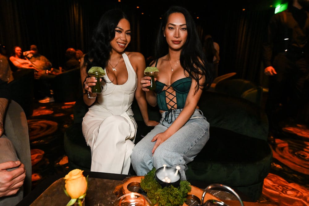 two girls sipping on Shroomin cocktail at Easys Live Music Las Vegas Venue