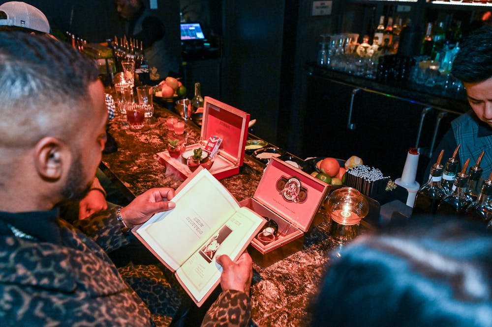 man ordering the smoke show cocktail at live music venue Easys