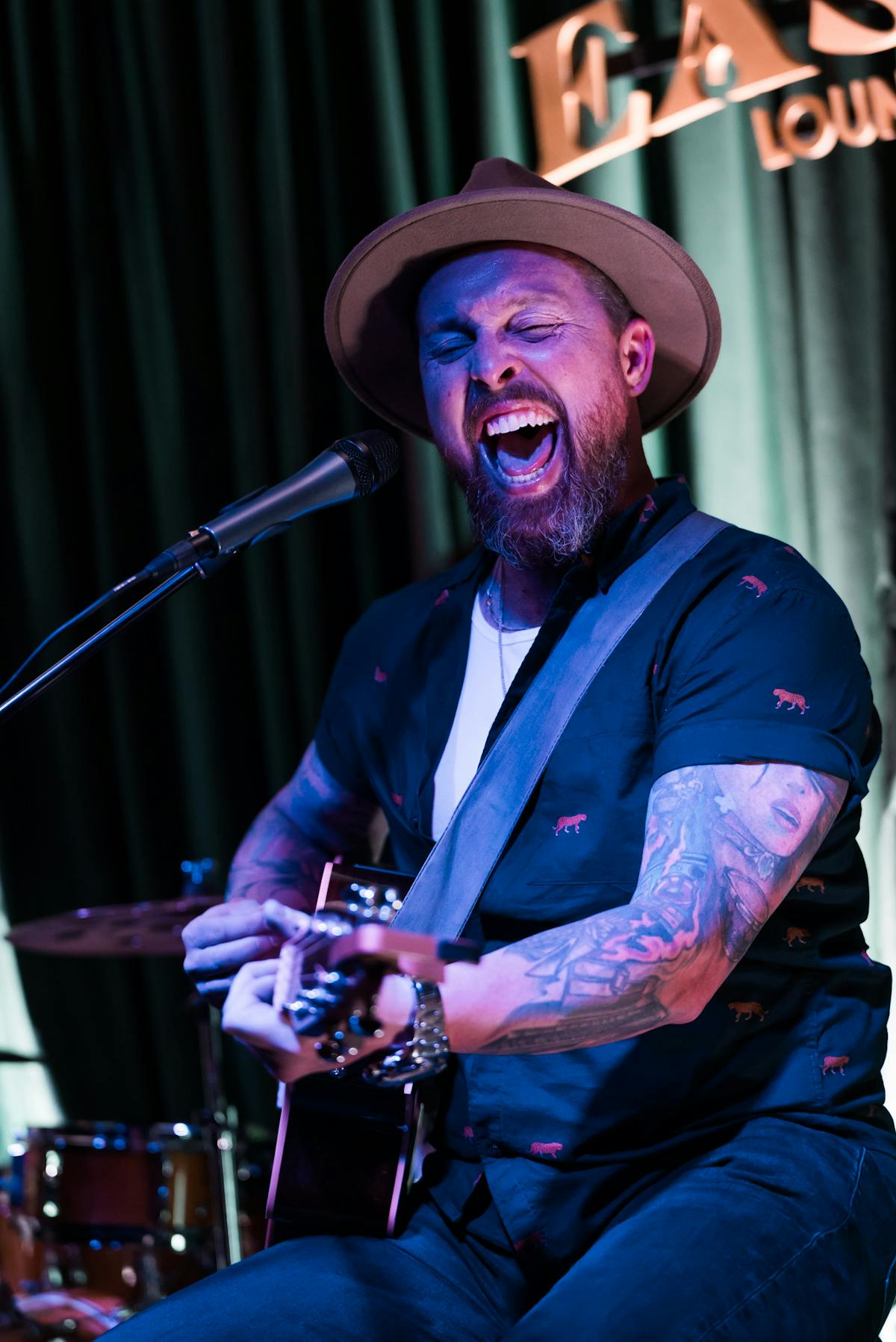 a man singing into a microphone