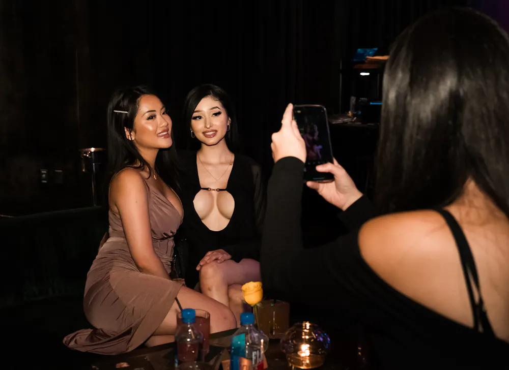 two girls taking a picture inside Las Vegas speakeasy Easys