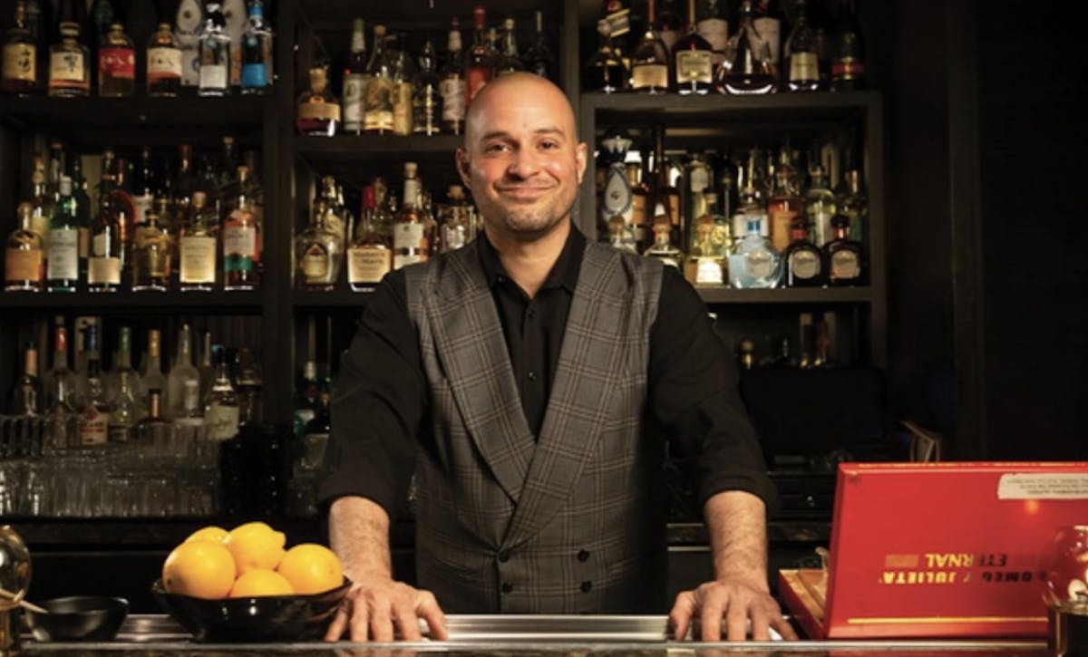 bartender at Easys Cocktail Lounge serving cocktails