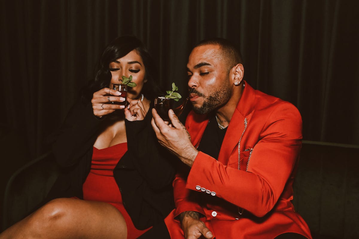 a man and a woman eating a sandwich