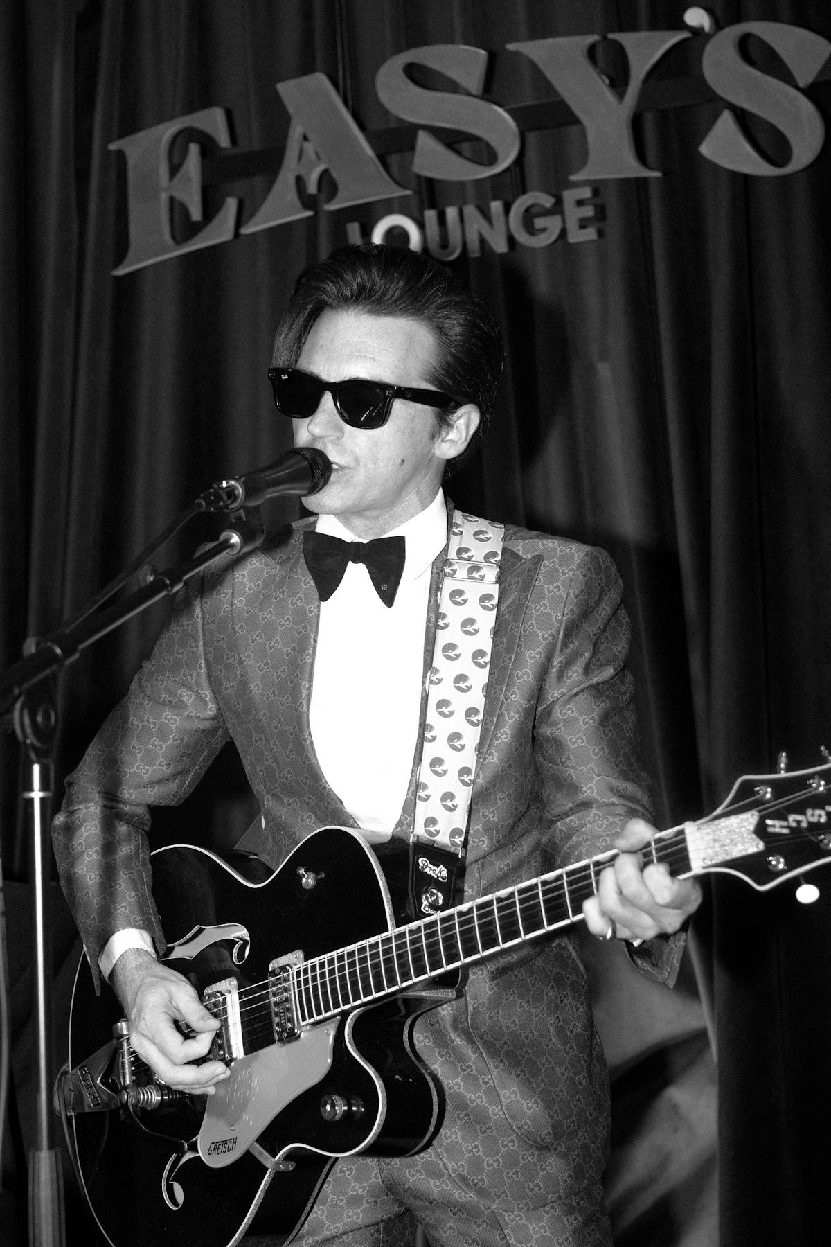 a man holding a guitar