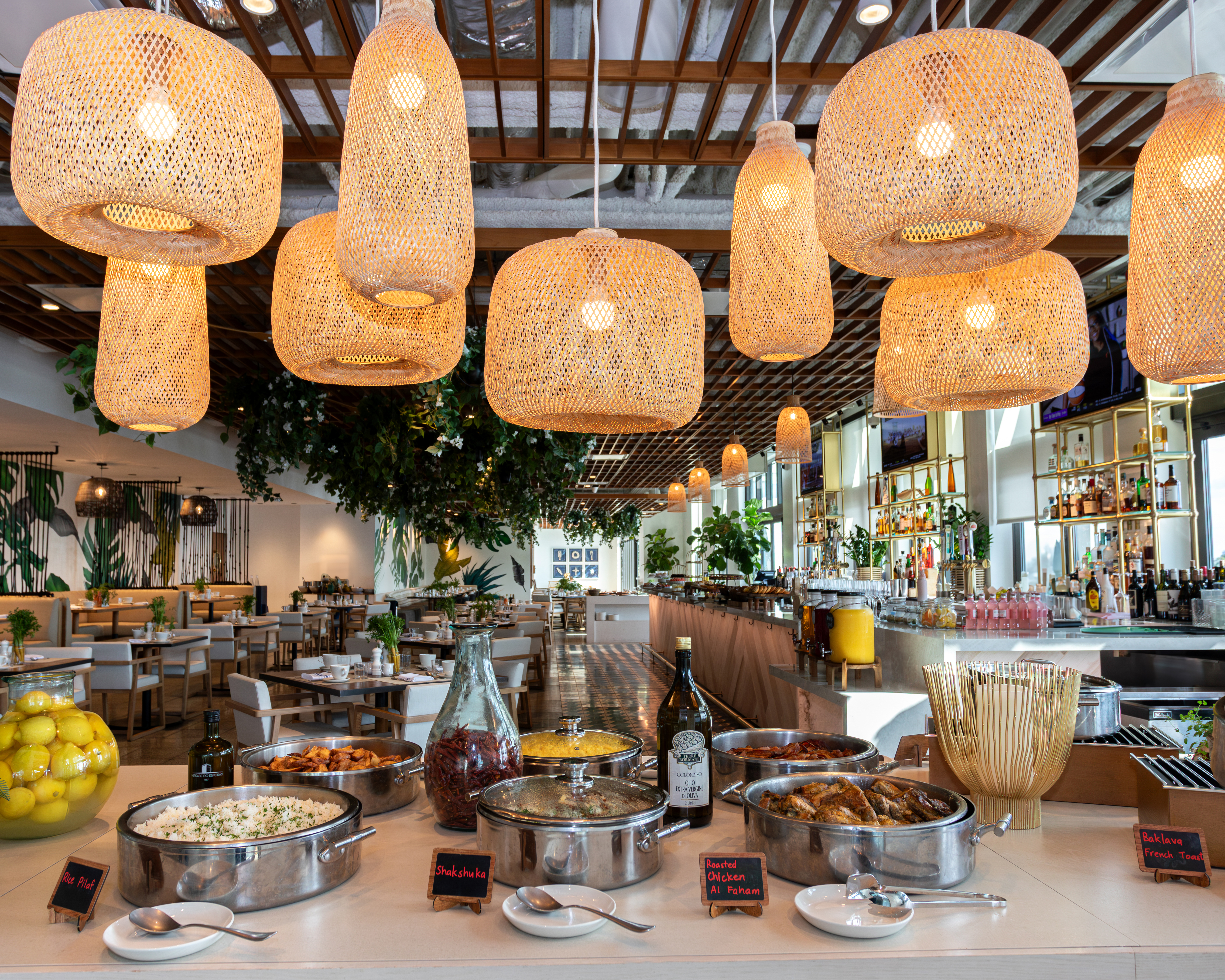 a group of people sitting at a table with a plate of food