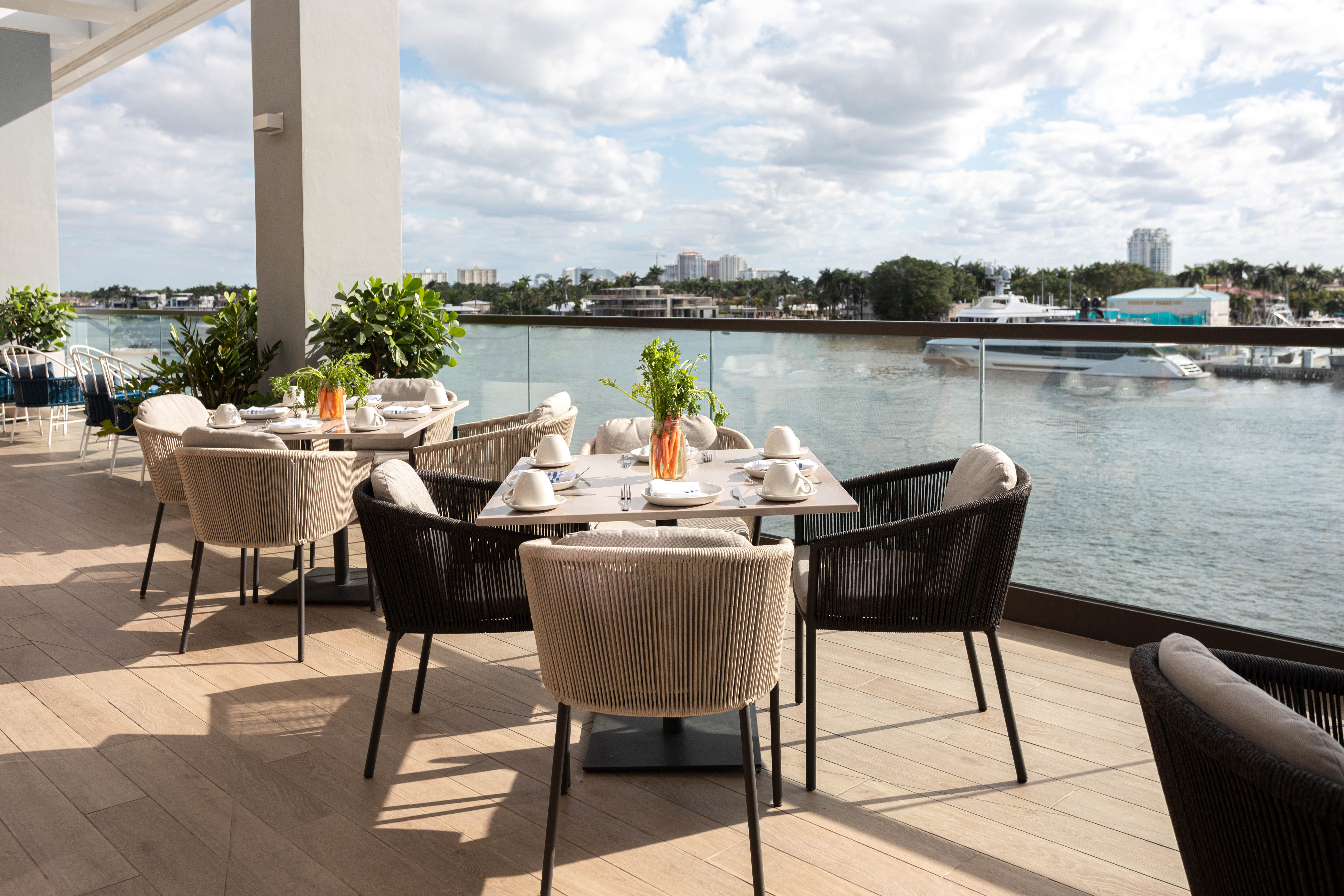 a group of people sitting at a table with a plate of food