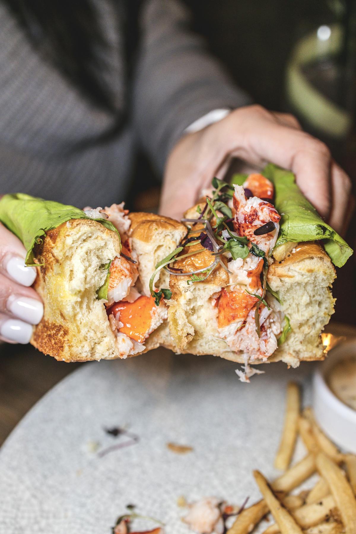a hand holding a piece of food