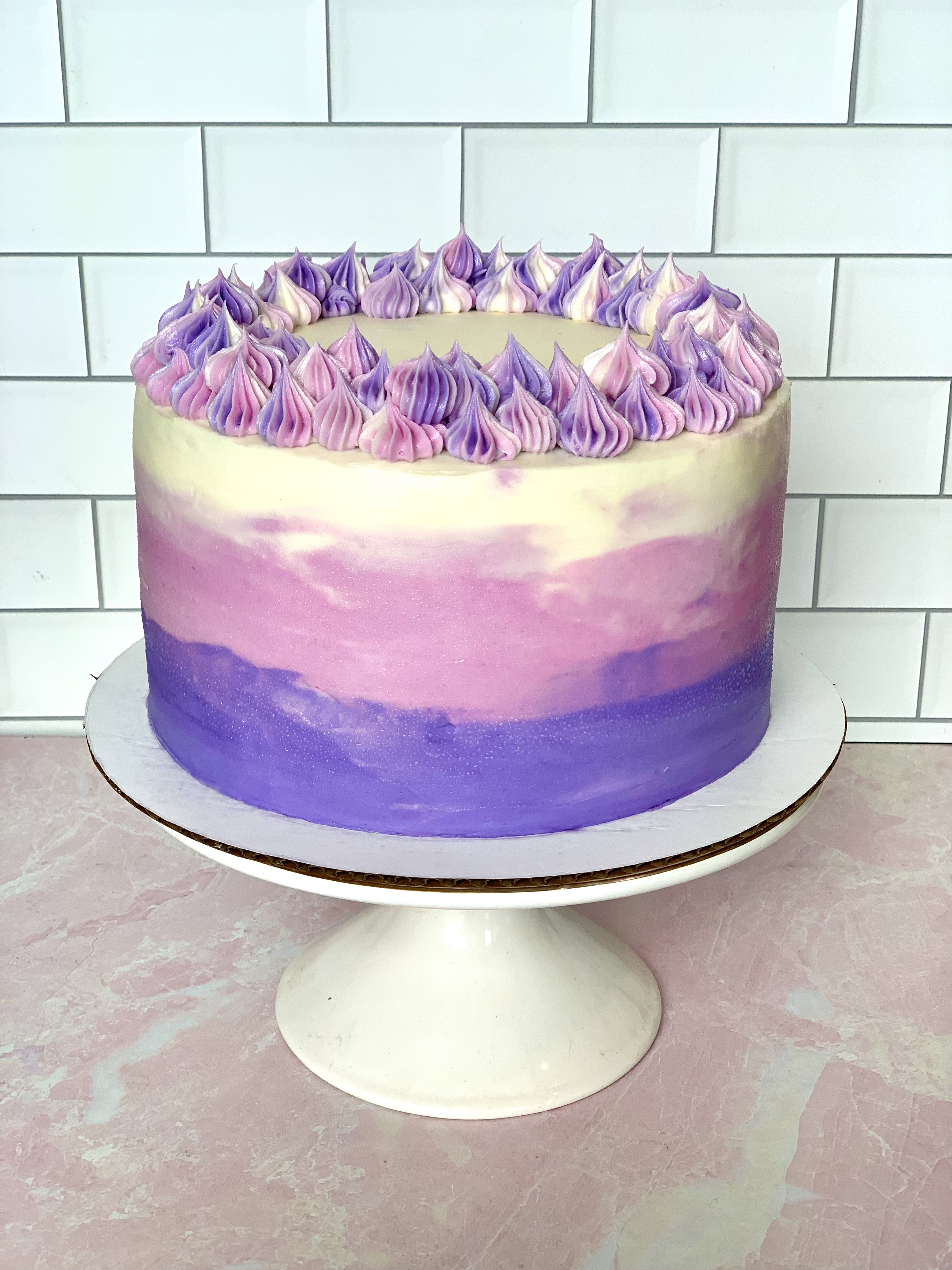 a blue and white cake on a table