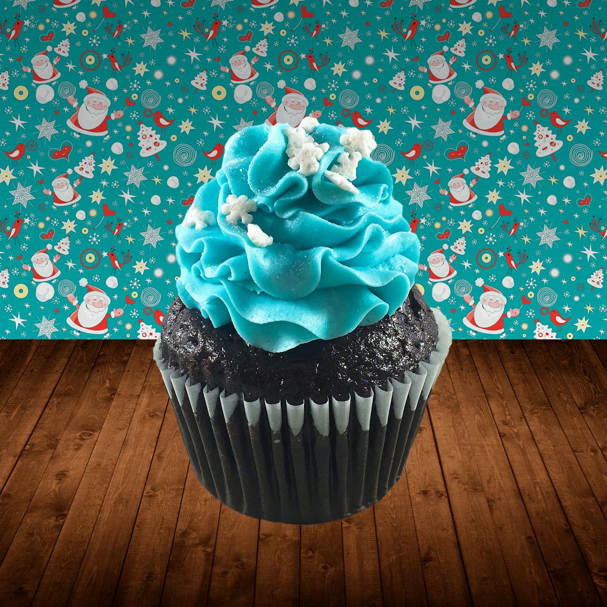 Chocolate cupcakes filled with mini chocolate chip cream cheese frosting, topped with sky blue cream cheese frosting, snowflake sprinkles and edible glitter