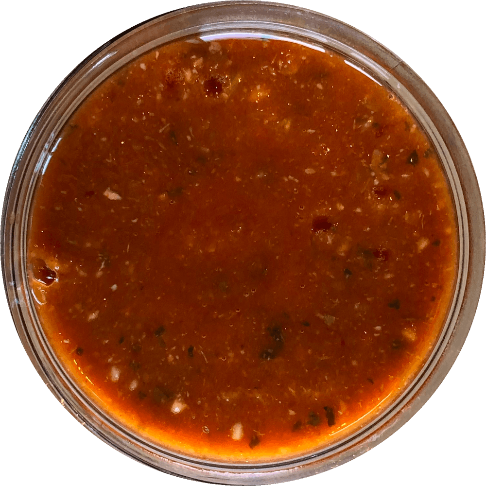 a close up of a sauce cup