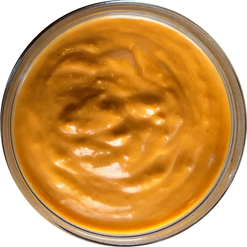 a close up of a sauce cup